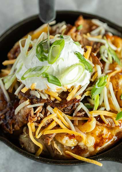 Loaded fries from our restaurant in Monticello MN, topped with cheese, pulled pork, and more.