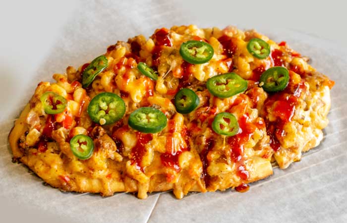 Flatbread topped with cheese, jalapeños, and sauce—perfect for any restaurant menu Monticello MN.