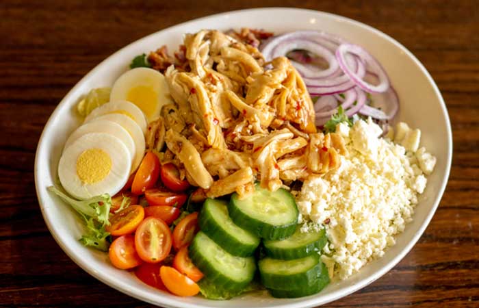 Featured on our restaurant menu in Monticello MN: Salad with chicken, cucumber, egg, and cheese.