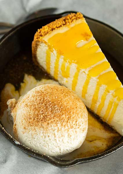 Cheesecake with yellow sauce and ice cream, served at our restaurant in Monticello MN.
