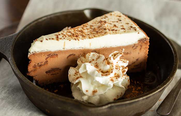 Indulge in this chocolate and cream cheesecake, a favorite on the restaurant menu Monticello MN.