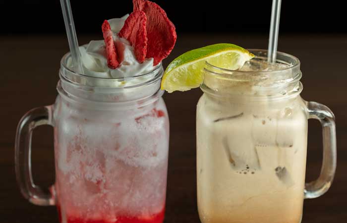 Refreshing drinks at our restaurant in Monticello MN: creamy strawberry and iced lime mason jars.