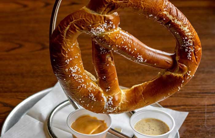 Enjoy a large salted pretzel from our restaurant menu in Monticello MN, served with two sauces.