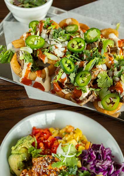 Loaded nachos and salads await at our restaurant in Monticello MN—fresh, zesty, and flavorful!.